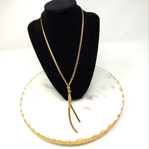 Elegant gold tone twist long necklace